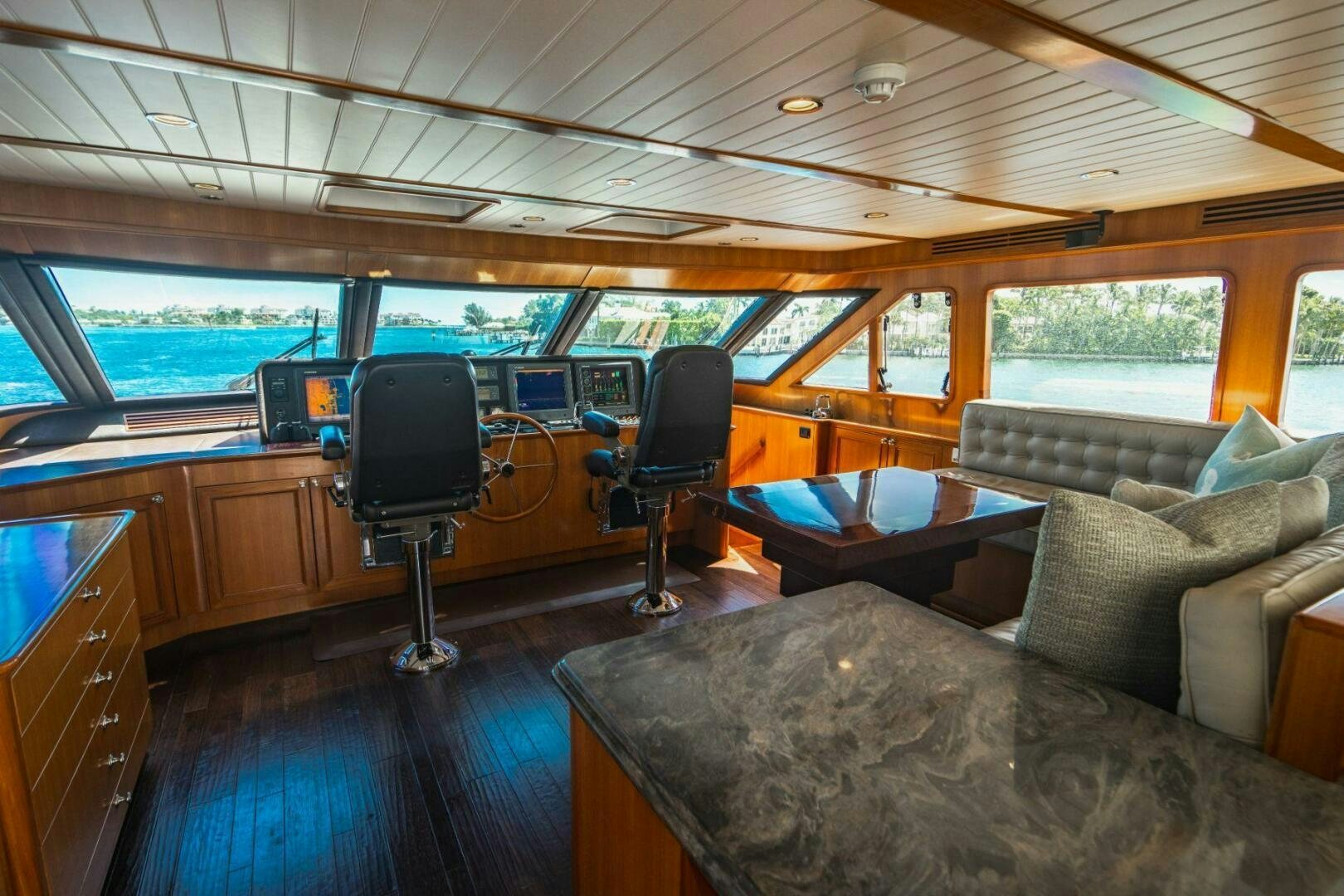 a living room with a large window aboard MOONSHOT Yacht for Sale