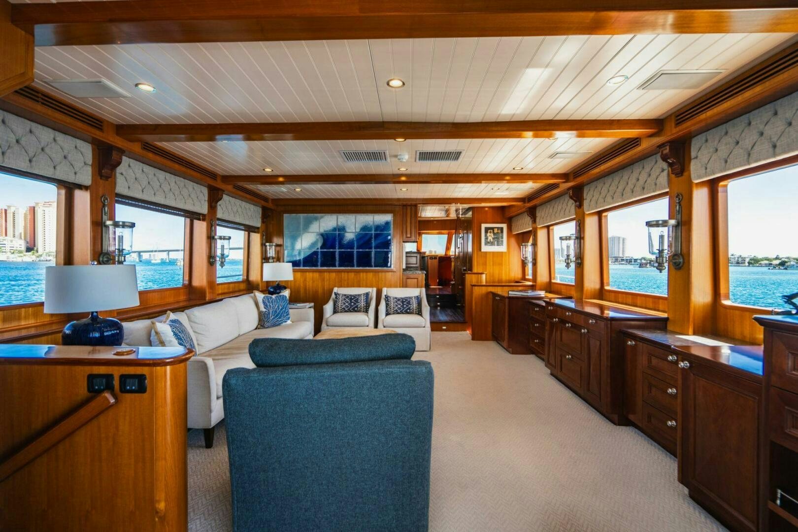 a large living room with a large window aboard MOONSHOT Yacht for Sale