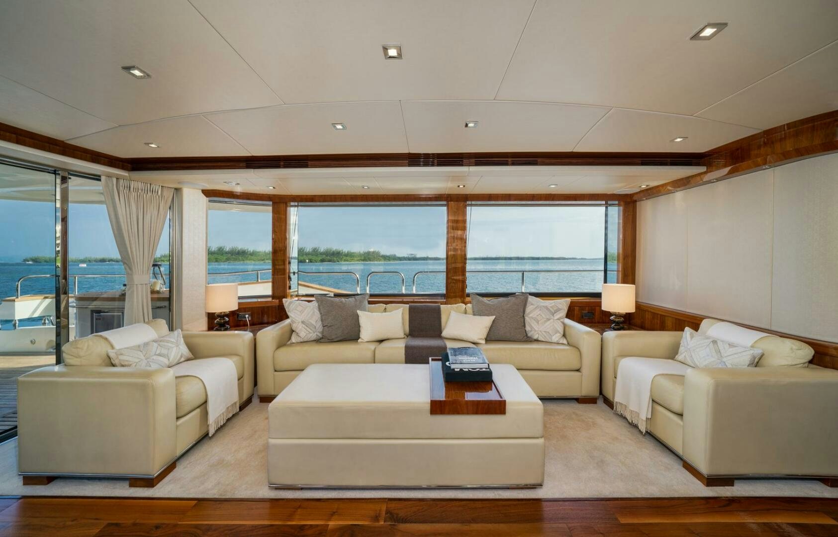 a living room with a large window aboard EBRA Yacht for Sale