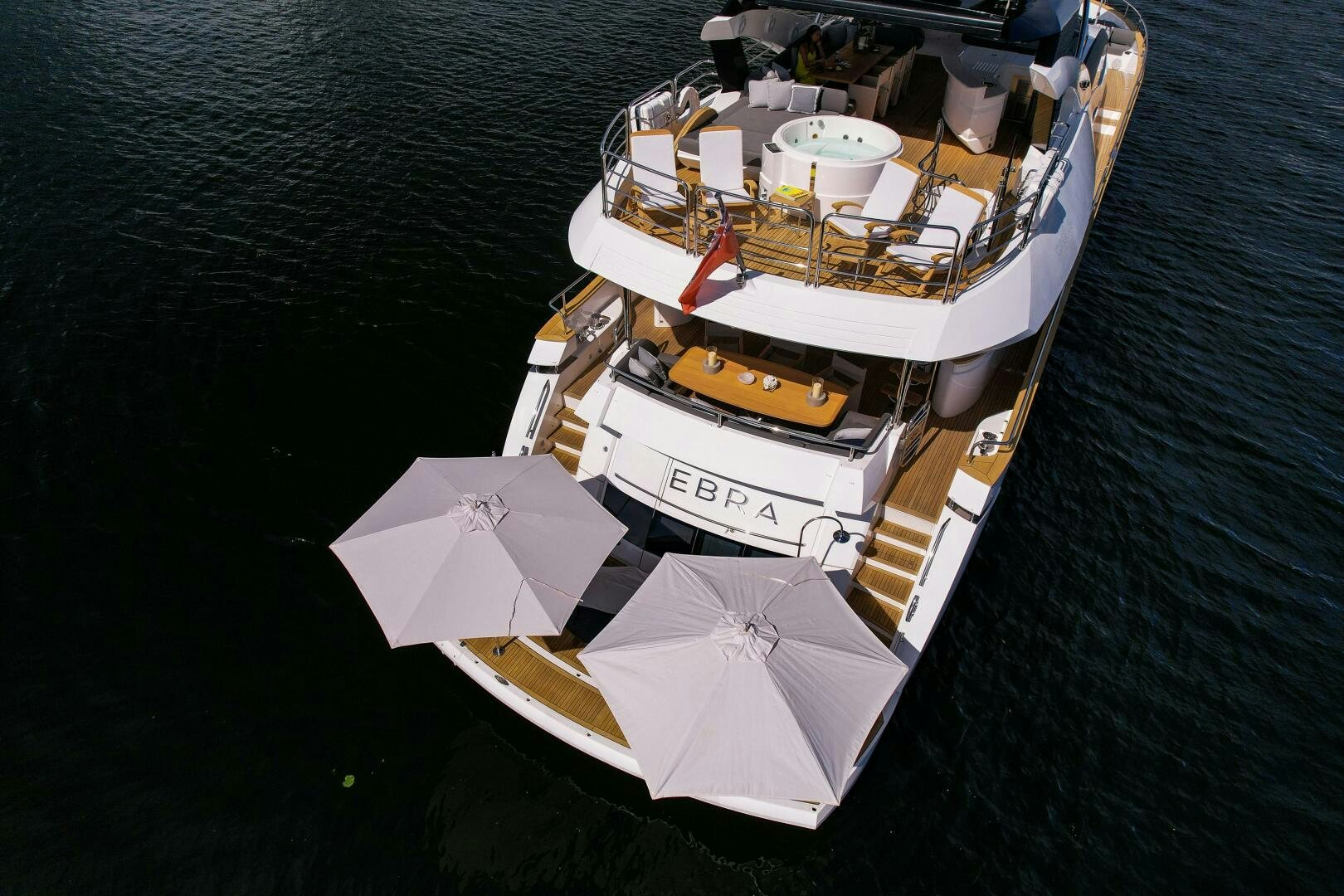 a boat with umbrellas on it aboard EBRA Yacht for Sale