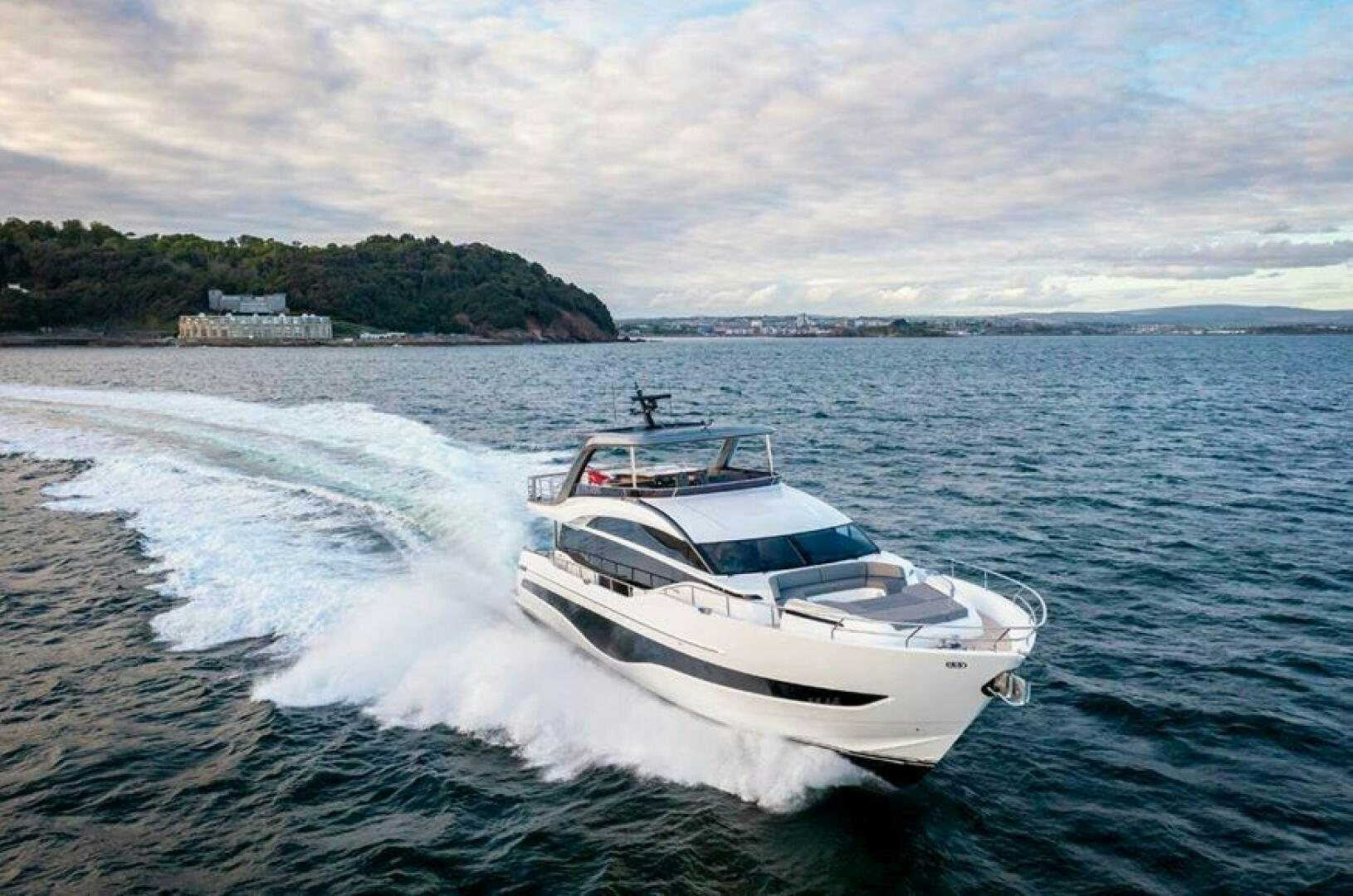 a white yacht on the water aboard SIDURI III  Yacht for Sale