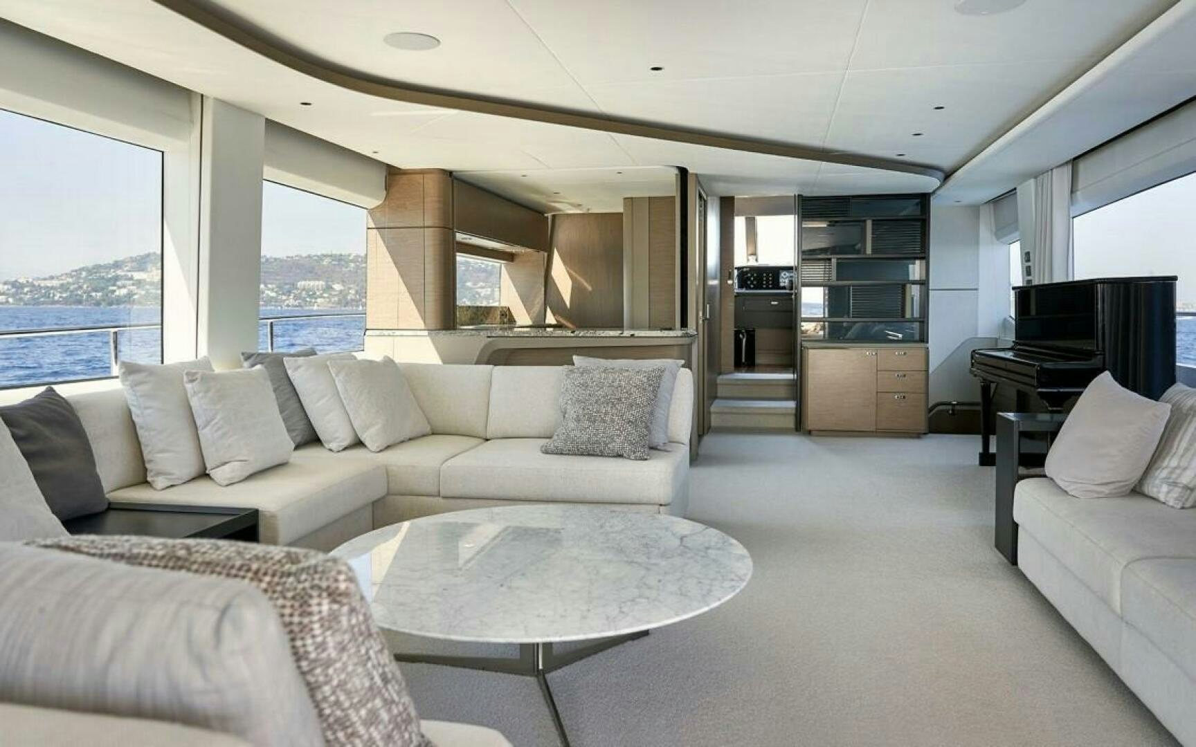 a living room with a couch and a table aboard SIDURI III  Yacht for Sale