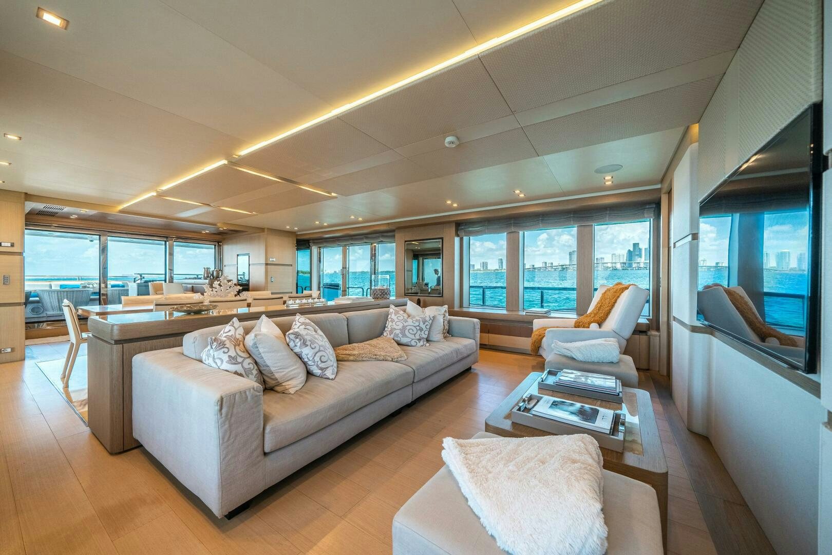 a living room with a large window aboard LEUDIN I Yacht for Sale