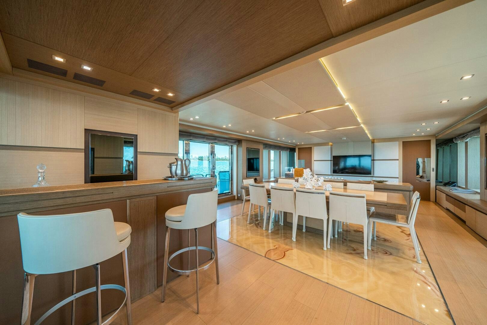 a kitchen with a table and chairs aboard LEUDIN I Yacht for Sale