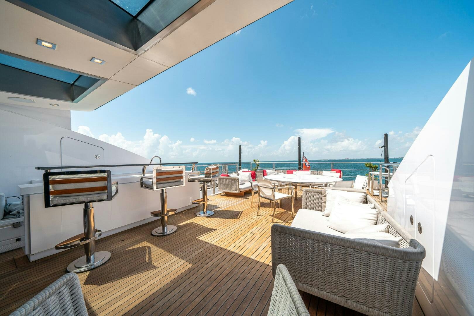 a deck with a view of the ocean and a deck aboard LEUDIN I Yacht for Sale