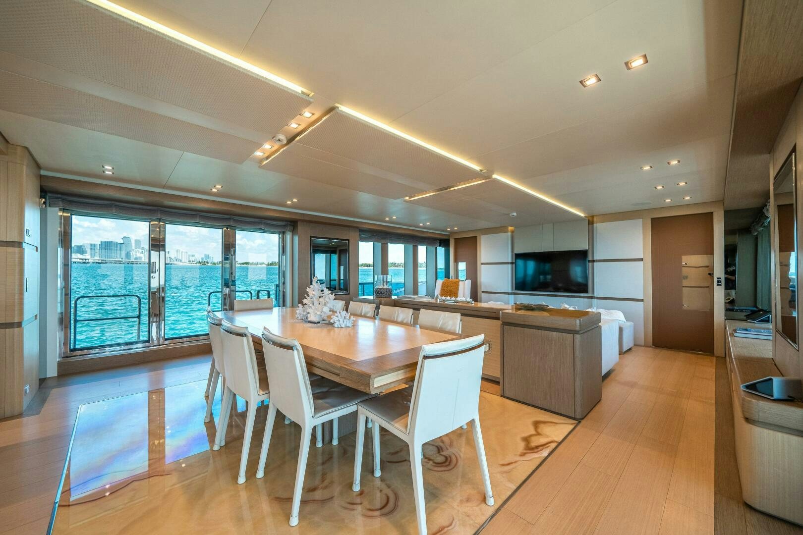 a large kitchen with a table and chairs aboard LEUDIN I Yacht for Sale