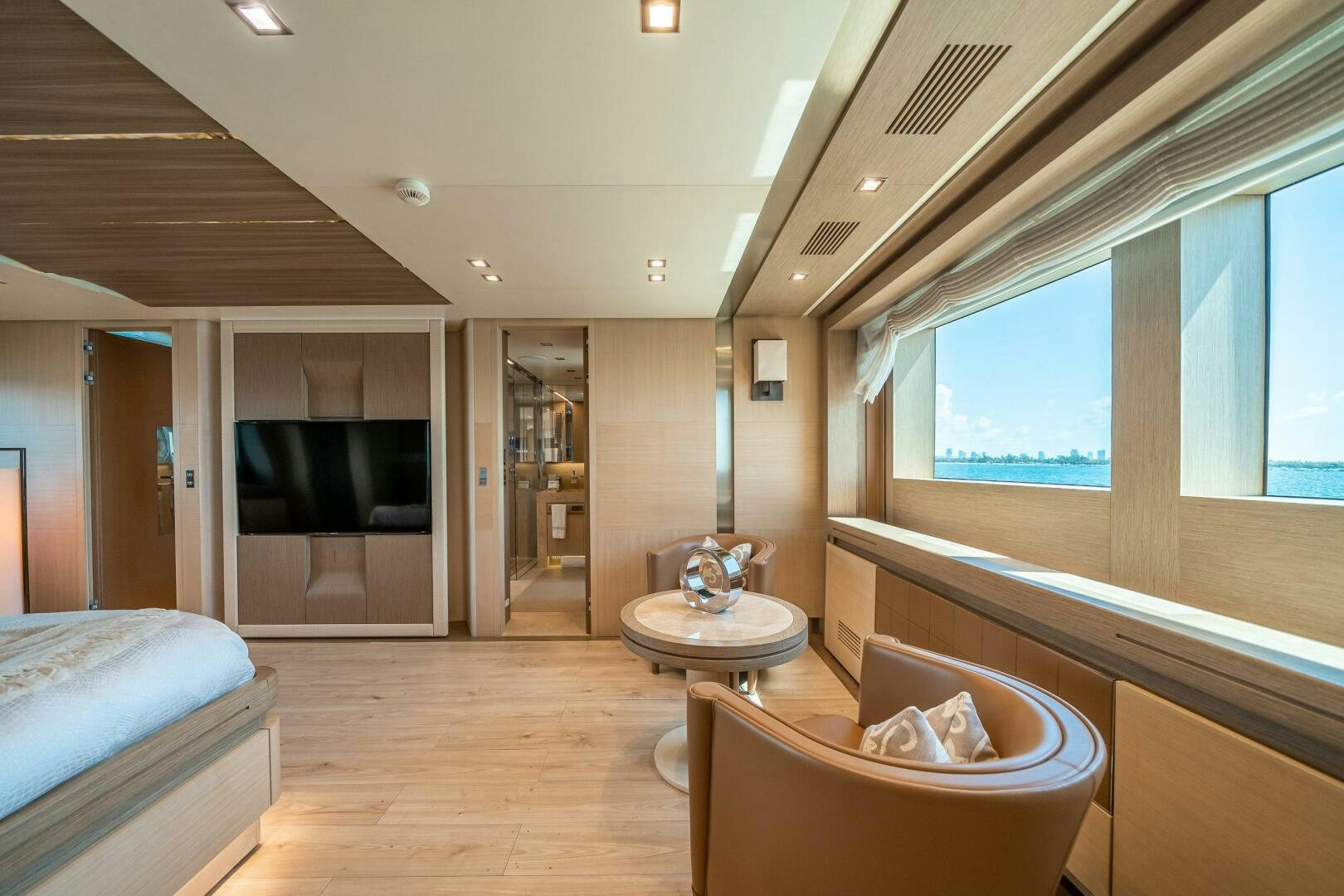 a modern looking bedroom with a large open door aboard LEUDIN I Yacht for Sale