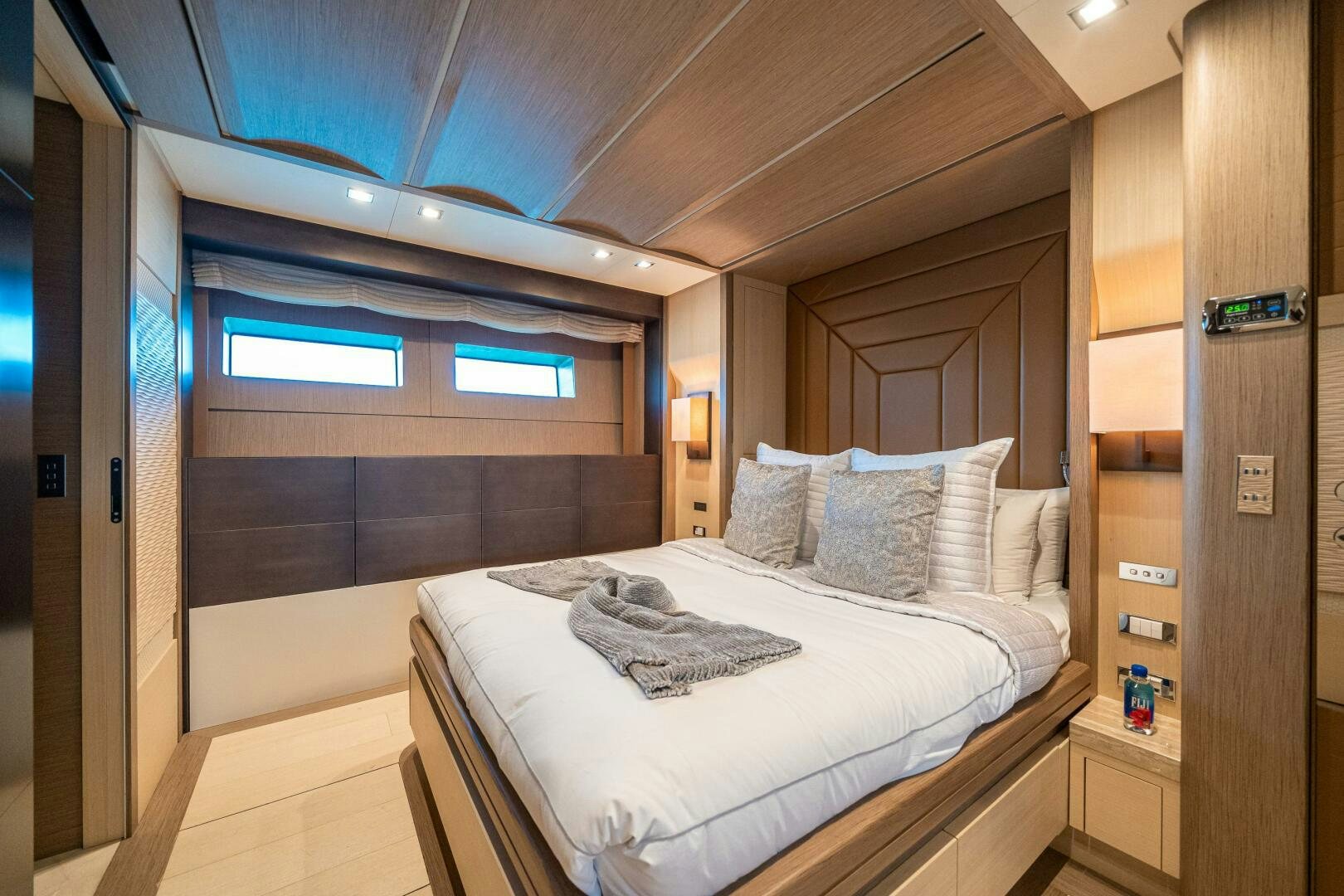 a room with a bed and a door aboard LEUDIN I Yacht for Sale