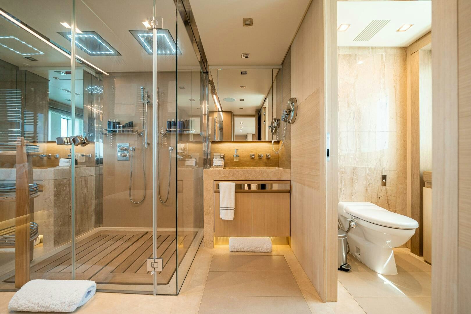 a bathroom with a glass shower aboard LEUDIN I Yacht for Sale
