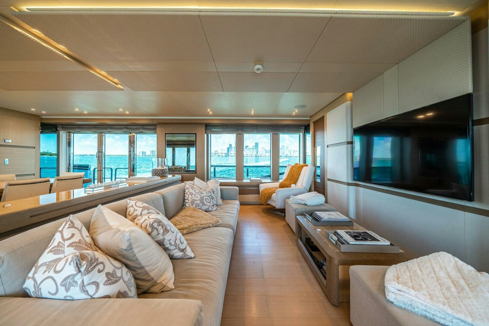 a living room with a large window aboard LEUDIN I Yacht for Sale