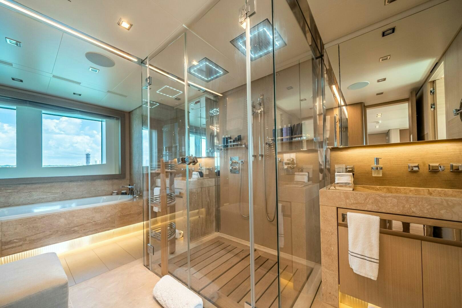 a bathroom with glass walls aboard LEUDIN I Yacht for Sale