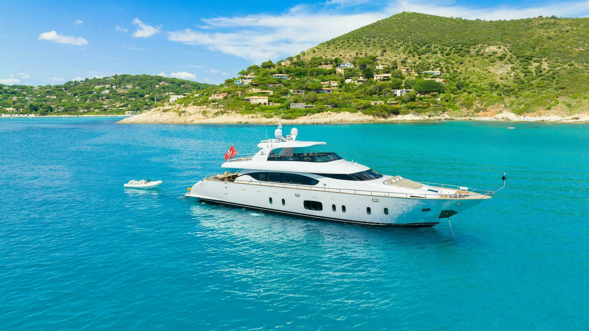 a white yacht in the water aboard DADDY'S DREAM Yacht for Sale