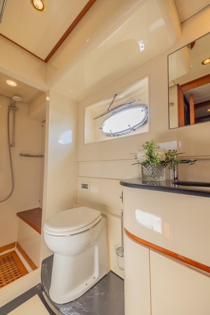 a bathroom with a toilet and a sink aboard BOULOS Yacht for Sale