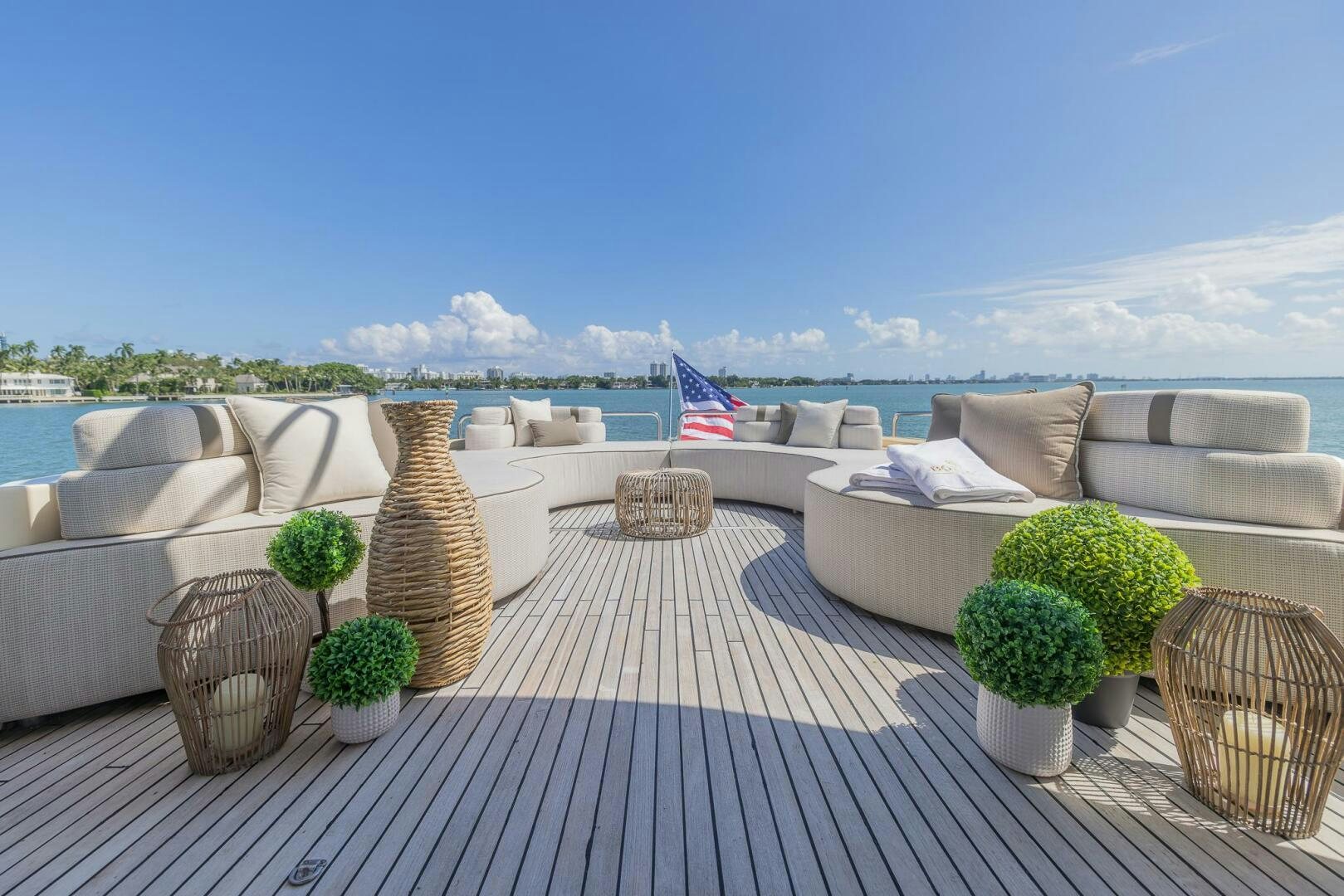a patio with a large group of potted plants and a flag aboard BOULOS Yacht for Sale