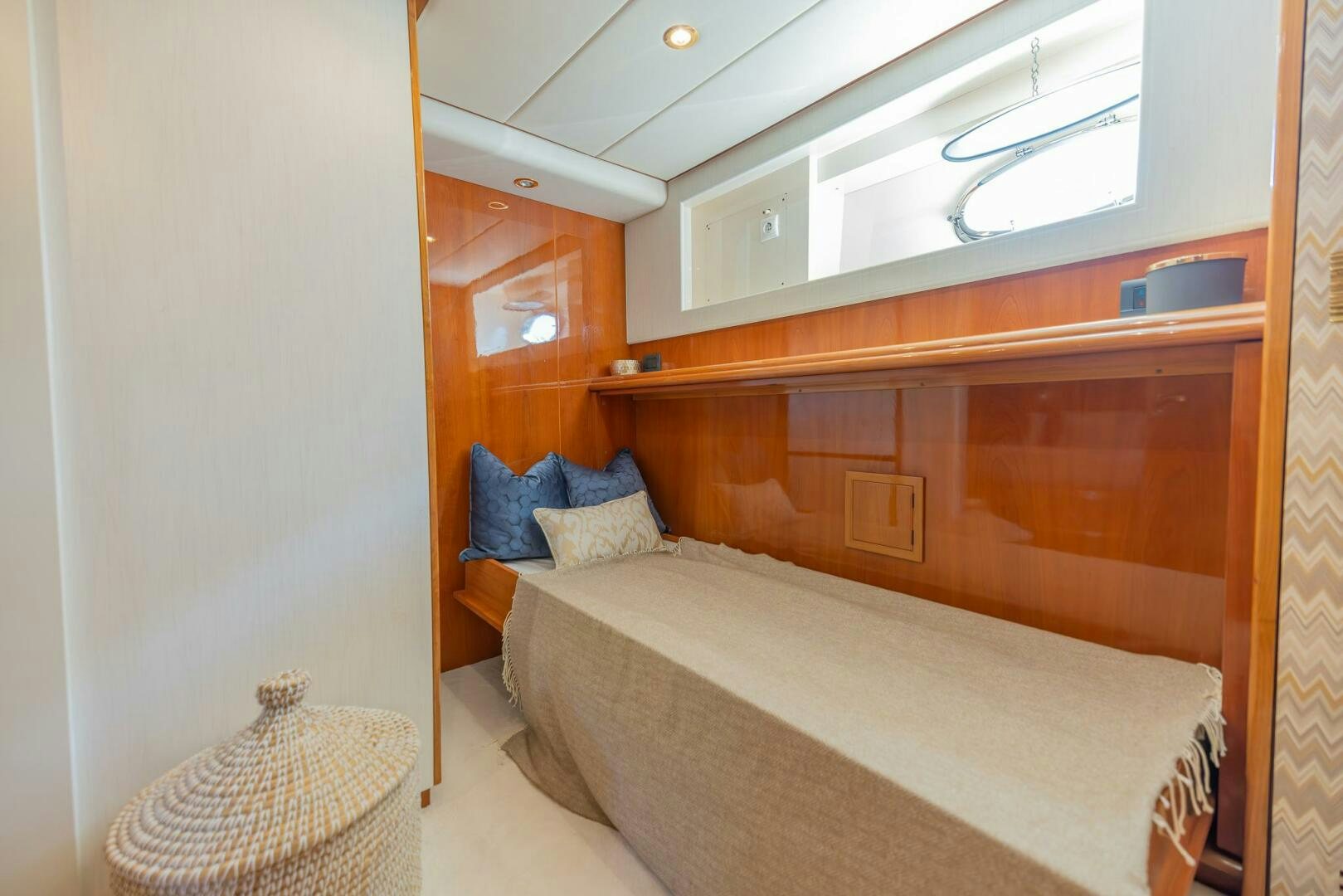 a bedroom with a bed and a chair aboard BOULOS Yacht for Sale