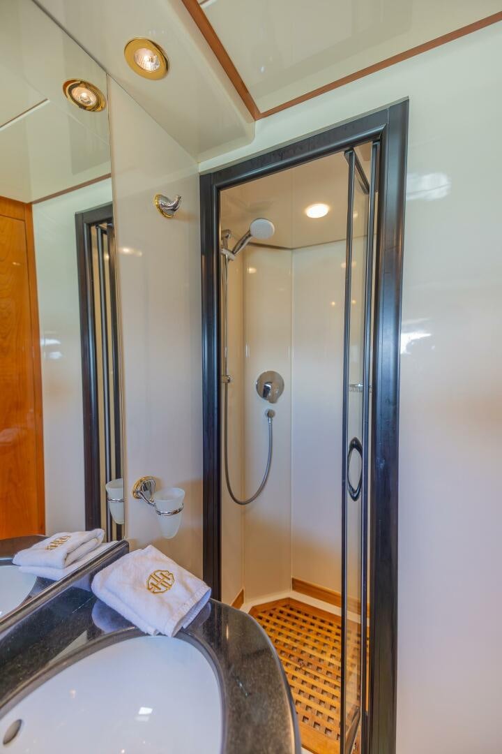 a bathroom with a glass shower aboard BOULOS Yacht for Sale