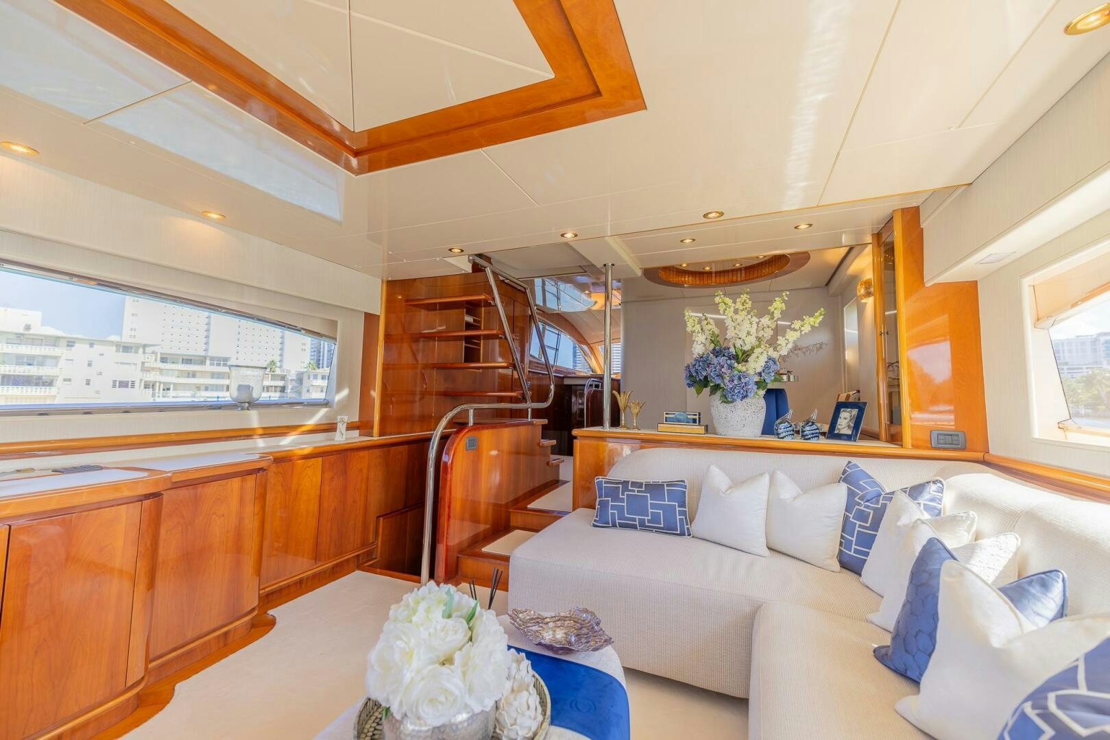 a living room with a white couch aboard BOULOS Yacht for Sale