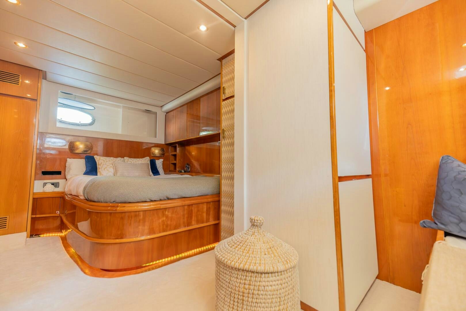 a bedroom with a bed and a mirror aboard BOULOS Yacht for Sale