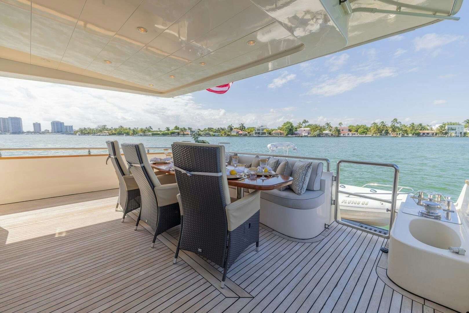 a table and chairs on a deck aboard BOULOS Yacht for Sale