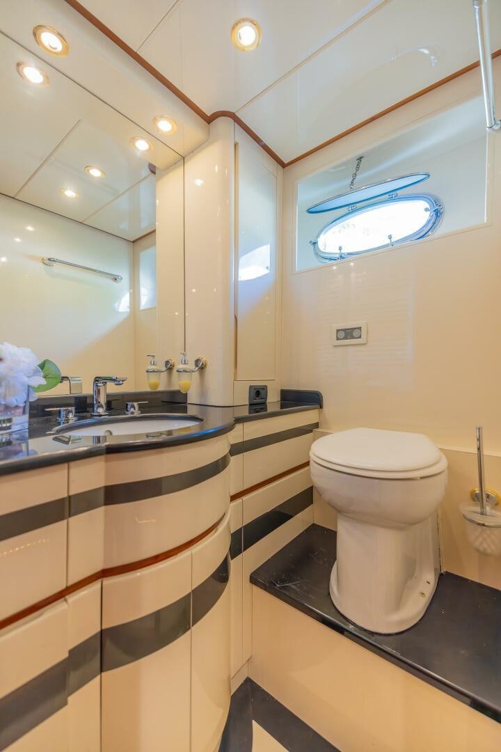 a bathroom with a toilet and a sink aboard BOULOS Yacht for Sale