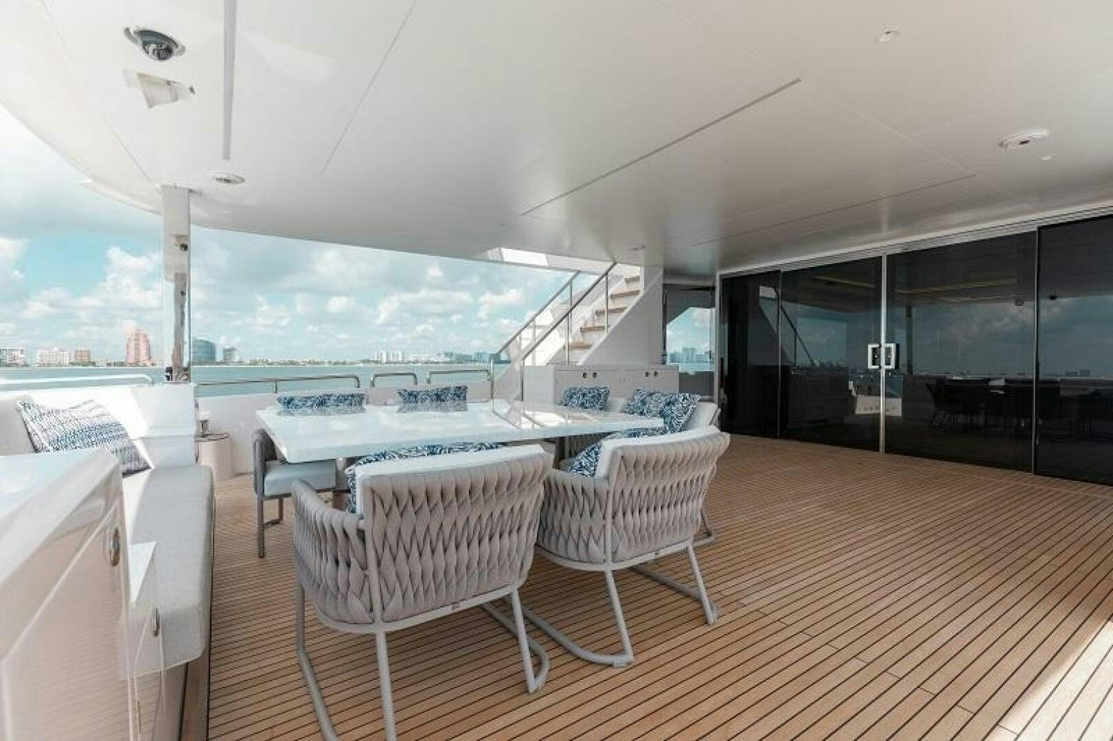 a room with a table chairs and a large window aboard WIGGLE ROOM Yacht for Sale