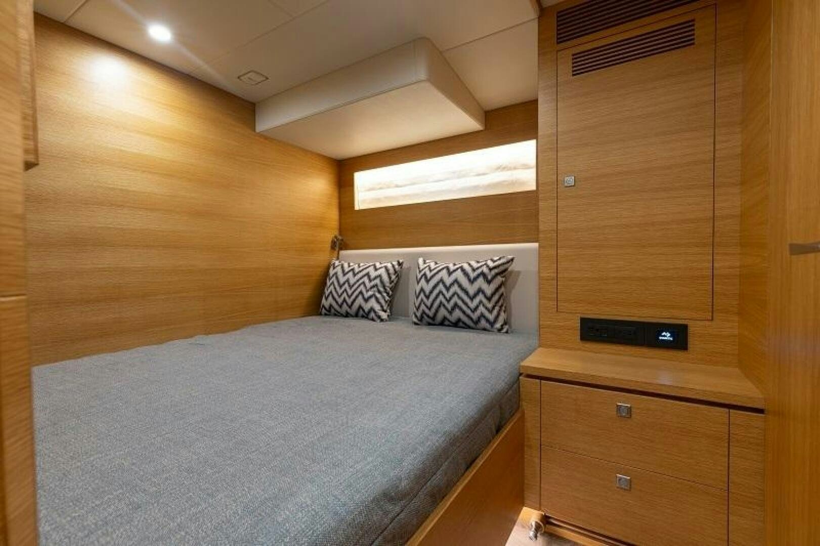 a bed in a room aboard WIGGLE ROOM Yacht for Sale