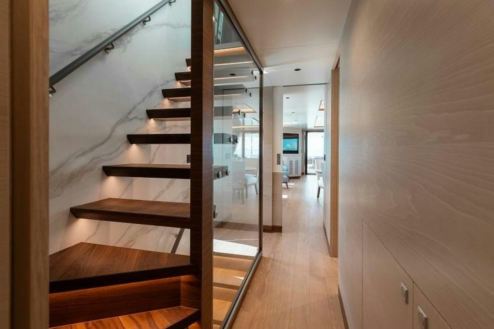 a hallway with wood floors aboard WIGGLE ROOM Yacht for Sale