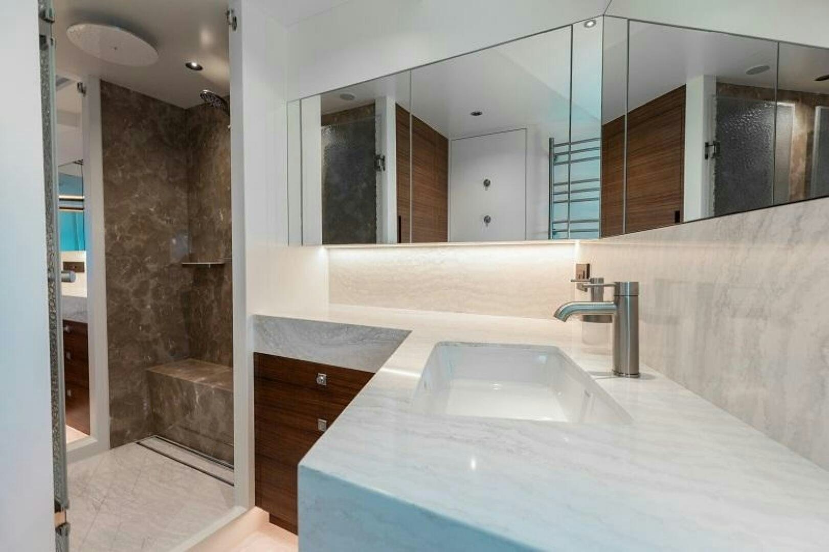 a bathroom with a large countertop aboard WIGGLE ROOM Yacht for Sale