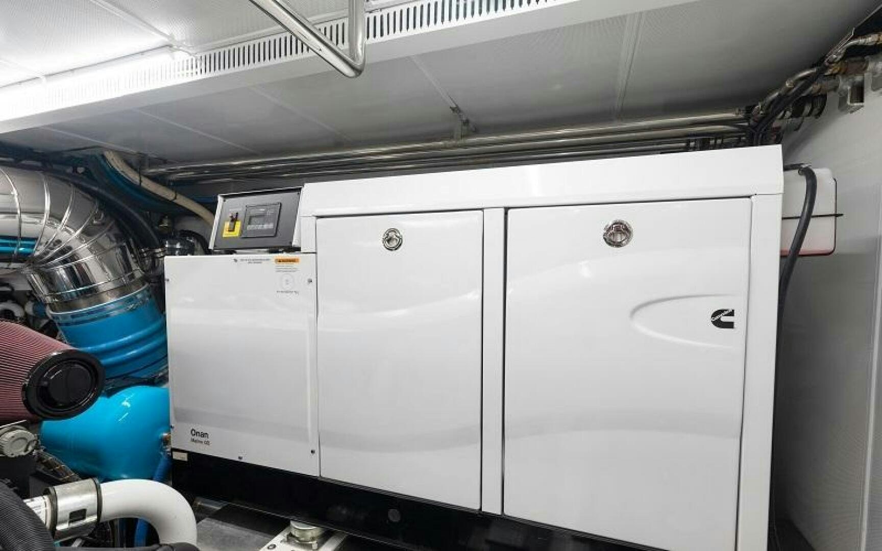 a machine with a large metal cylinder aboard WIGGLE ROOM Yacht for Sale