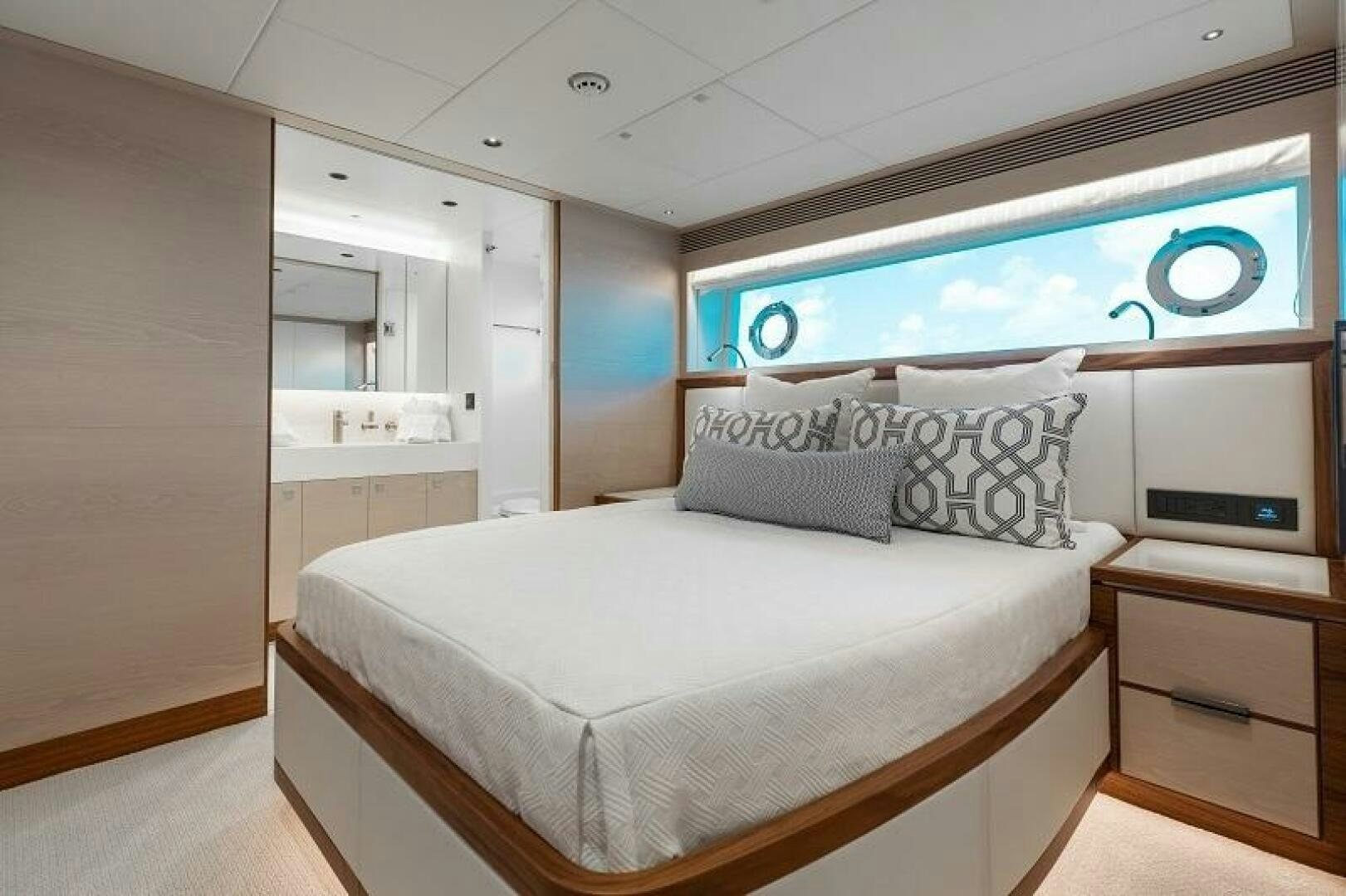 a room with a bed and a window aboard WIGGLE ROOM Yacht for Sale