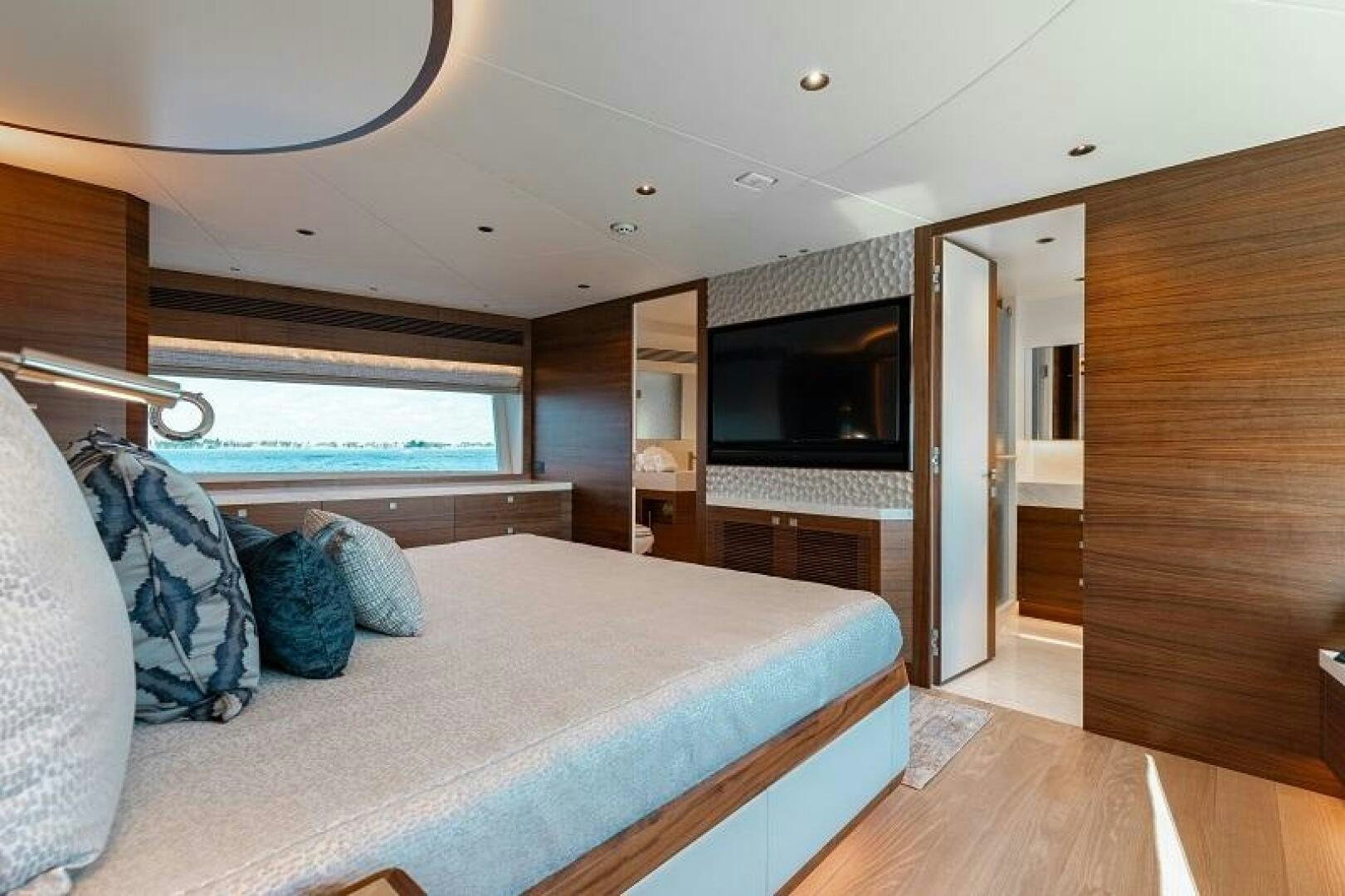 a bedroom with a large bed aboard WIGGLE ROOM Yacht for Sale