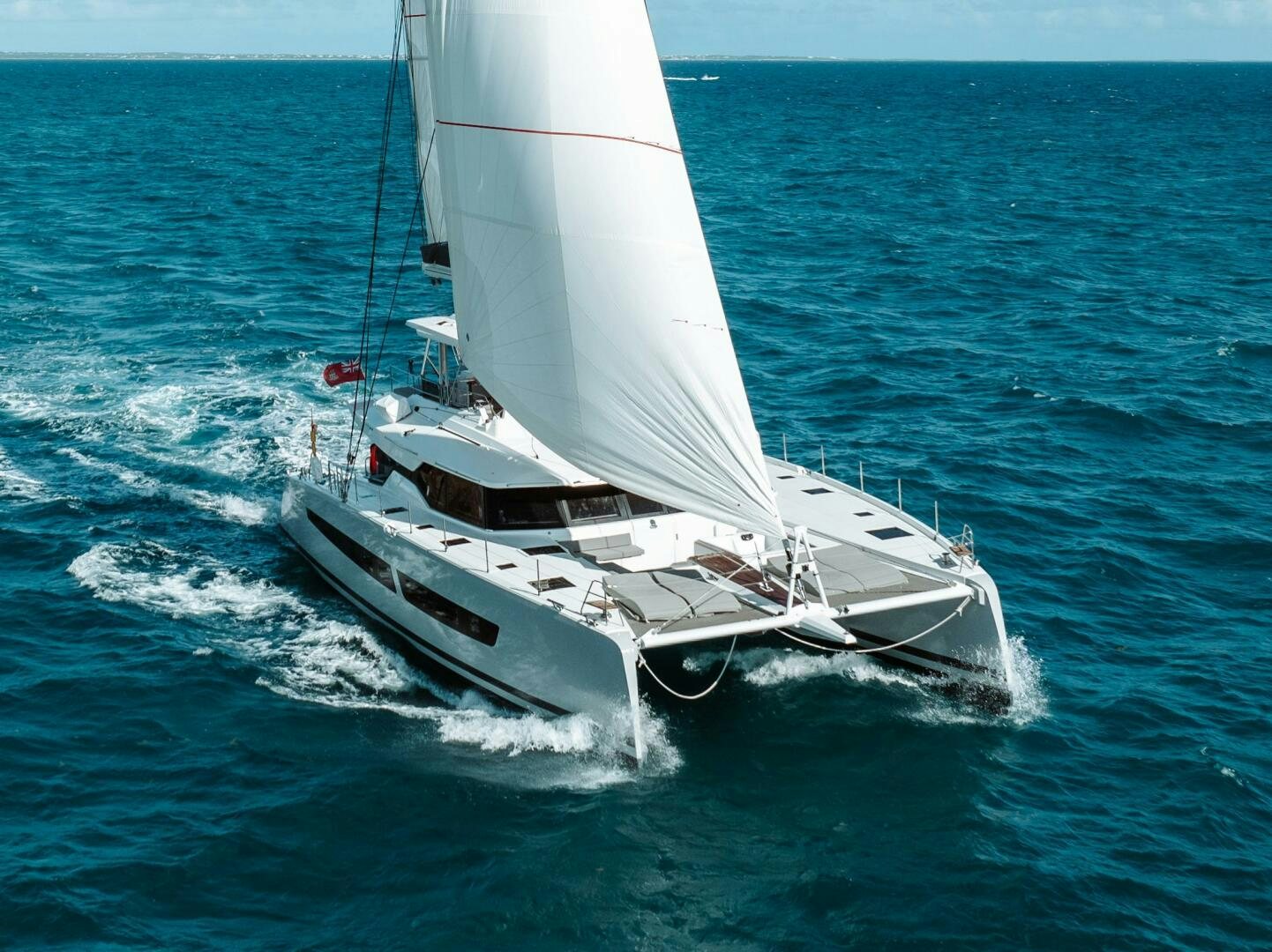 a white boat on the water aboard OCEANUS Yacht for Sale