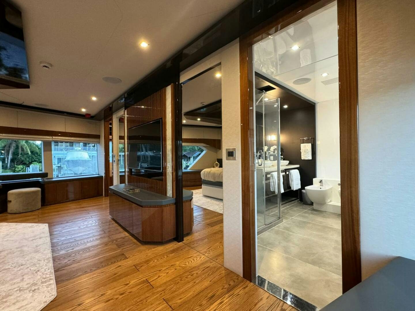 a large glass shower unit in a room with a wood floor aboard LADY CAROLINE Yacht for Sale