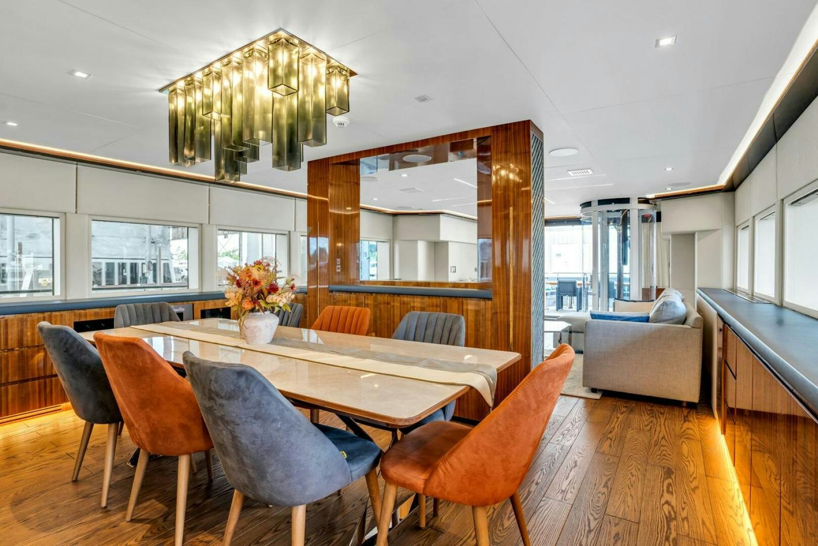 a dining room with a table and chairs aboard LADY CAROLINE Yacht for Sale