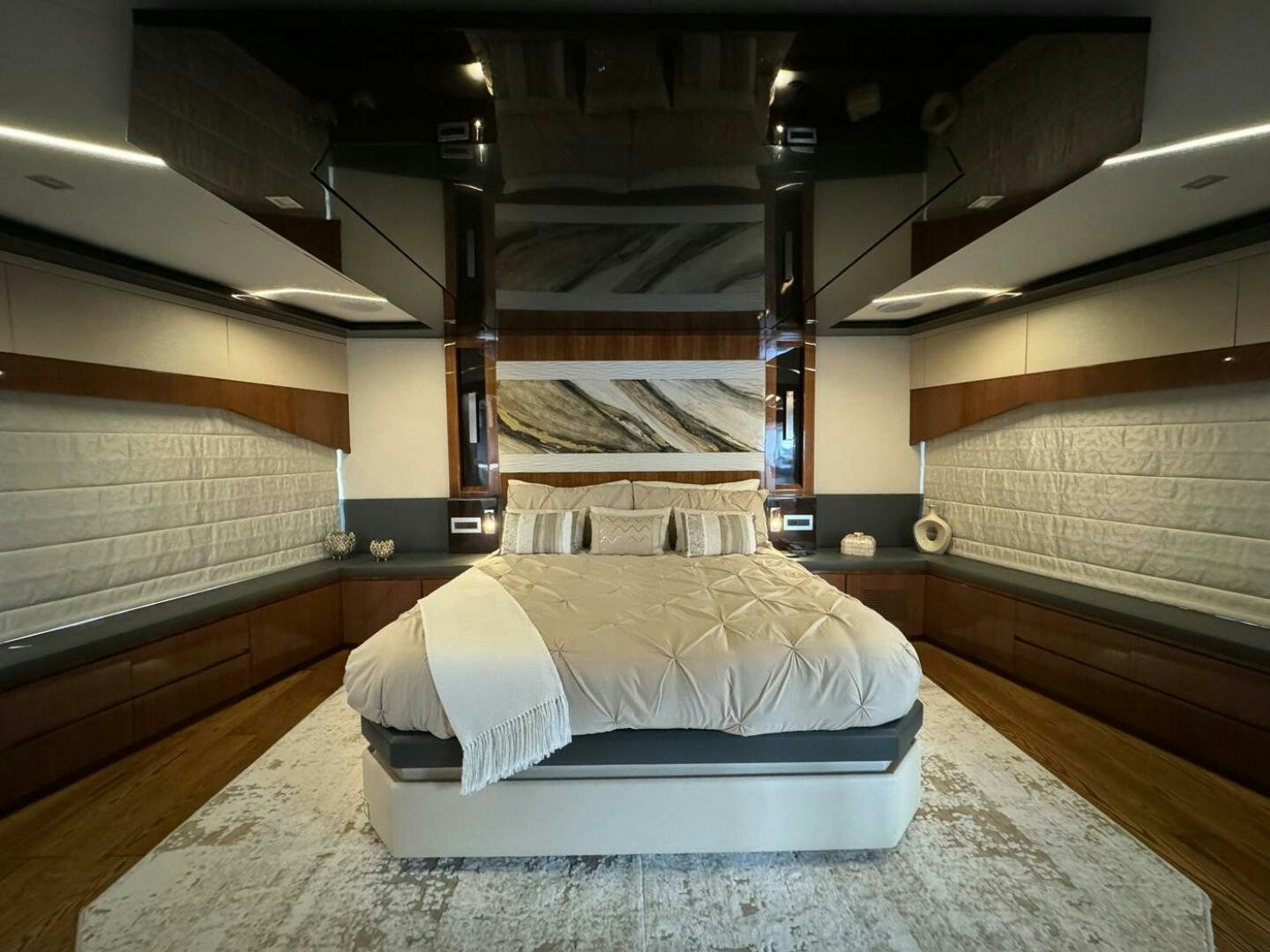 a room with a bed and a large wooden wall aboard LADY CAROLINE Yacht for Sale