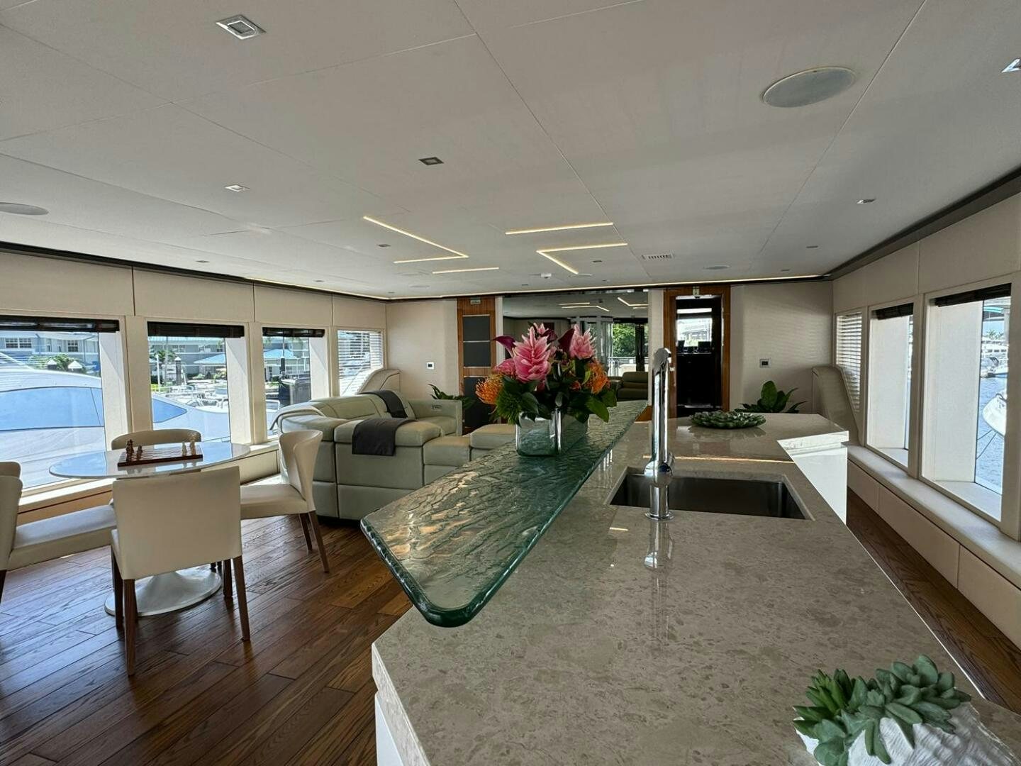 a living room with a table and chairs aboard LADY CAROLINE Yacht for Sale