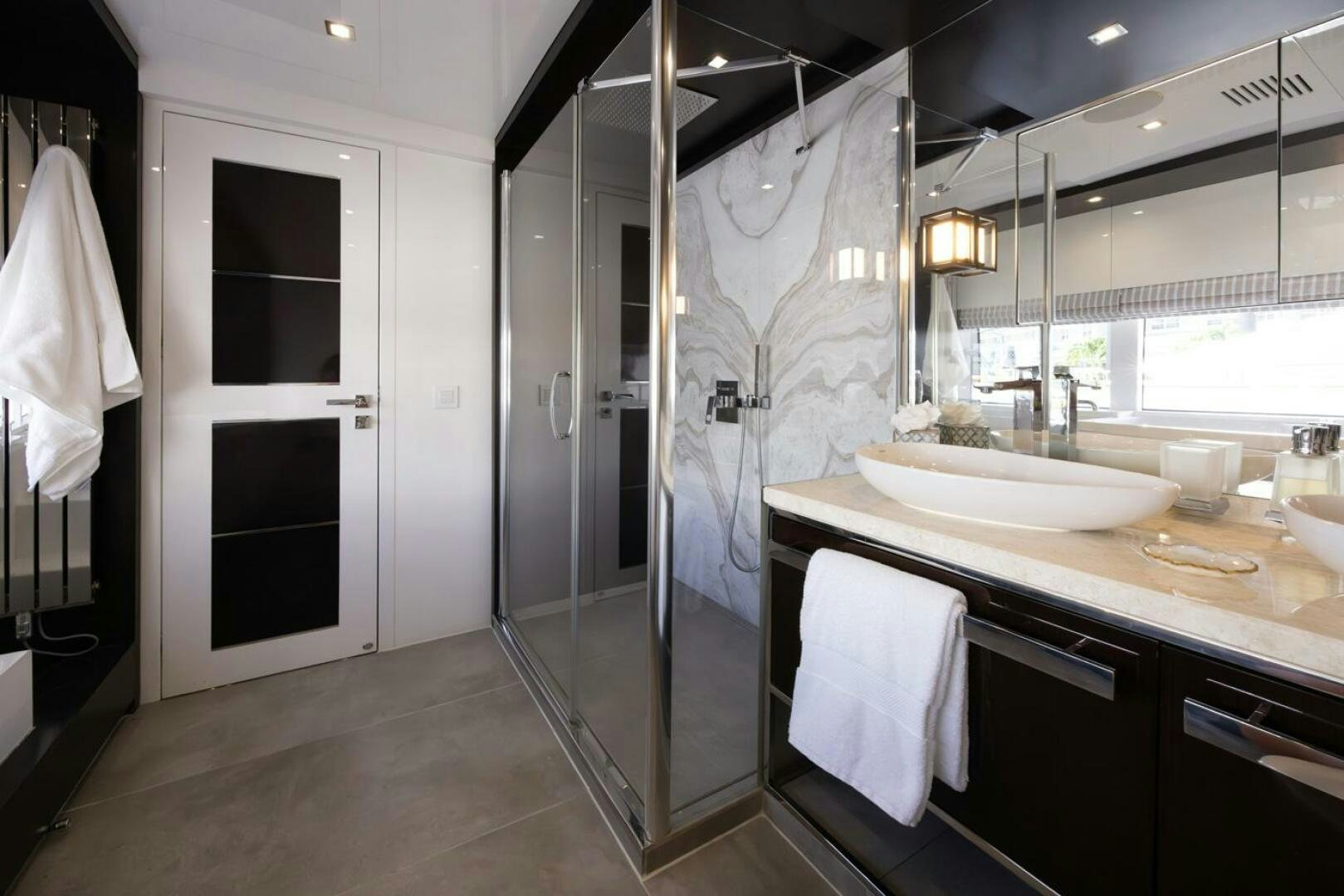 a bathroom with a sink and a shower aboard LADY CAROLINE Yacht for Sale