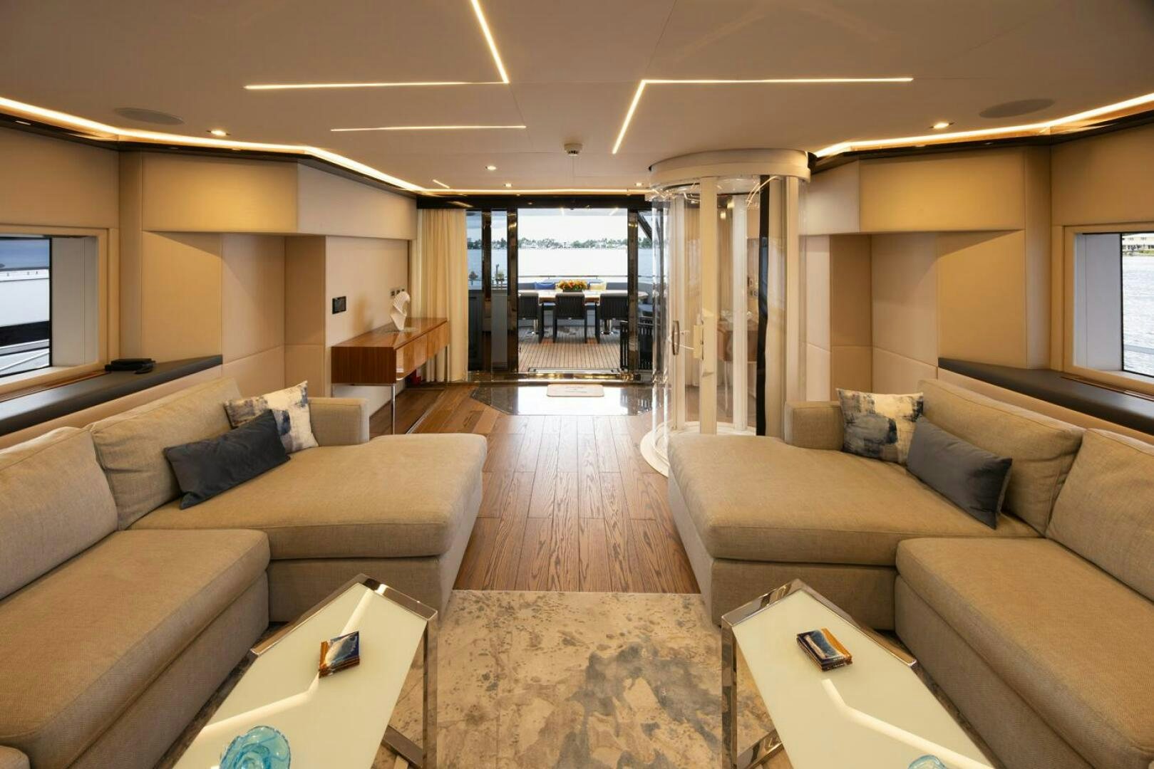 a living room with a couch and a table aboard LADY CAROLINE Yacht for Sale