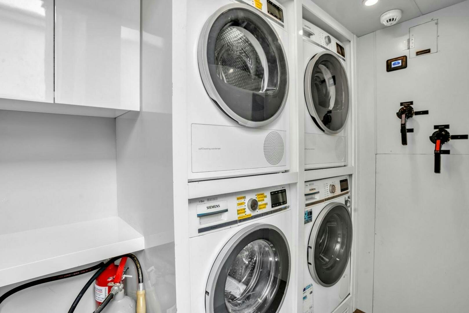 a white laundry room aboard LADY CAROLINE Yacht for Sale