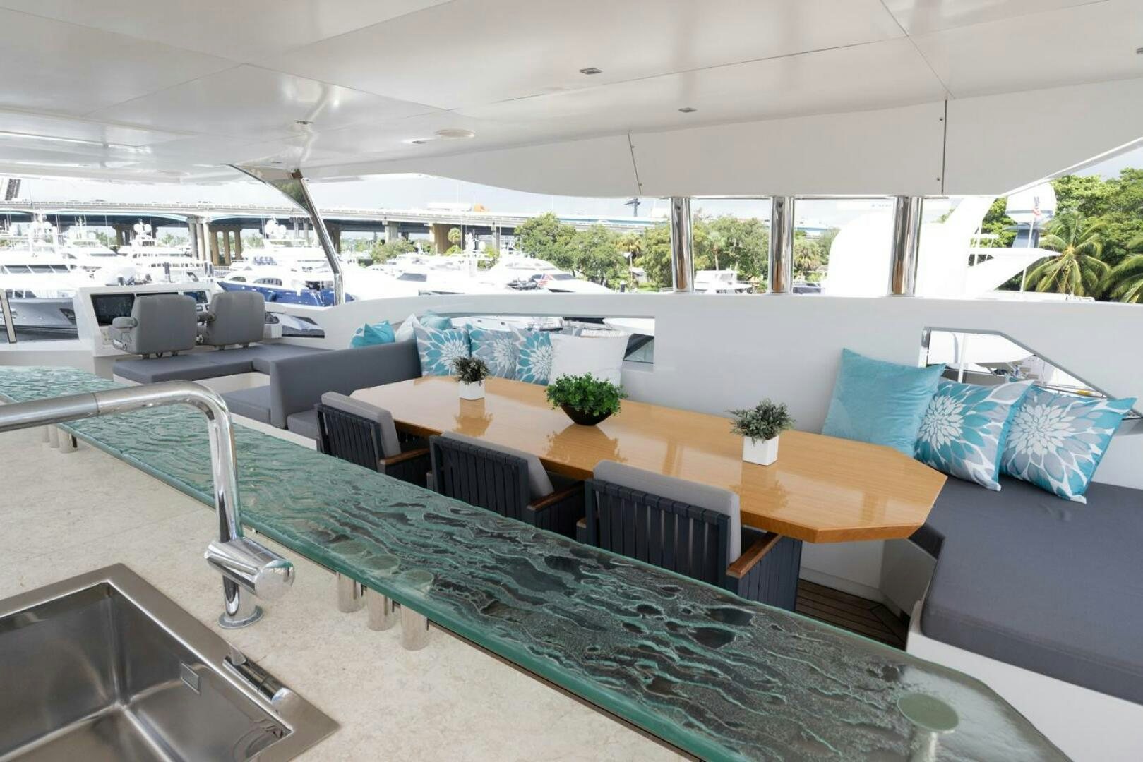 a large room with a table and chairs aboard LADY CAROLINE Yacht for Sale
