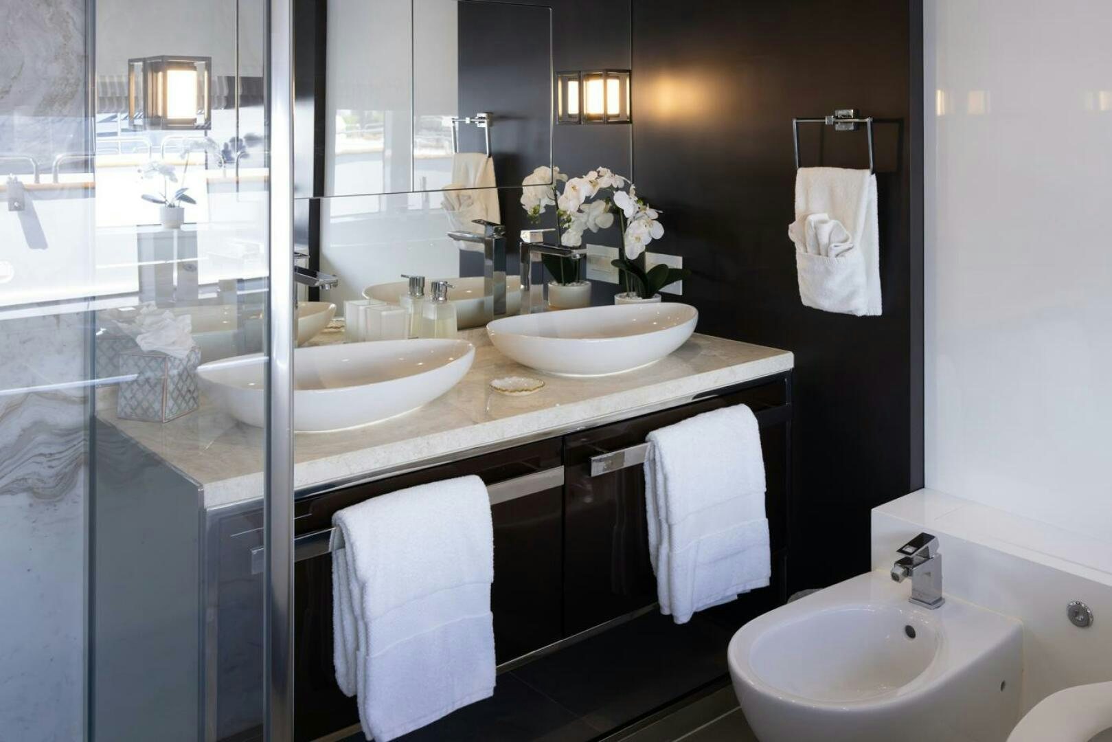 a bathroom with sinks and mirrors aboard LADY CAROLINE Yacht for Sale