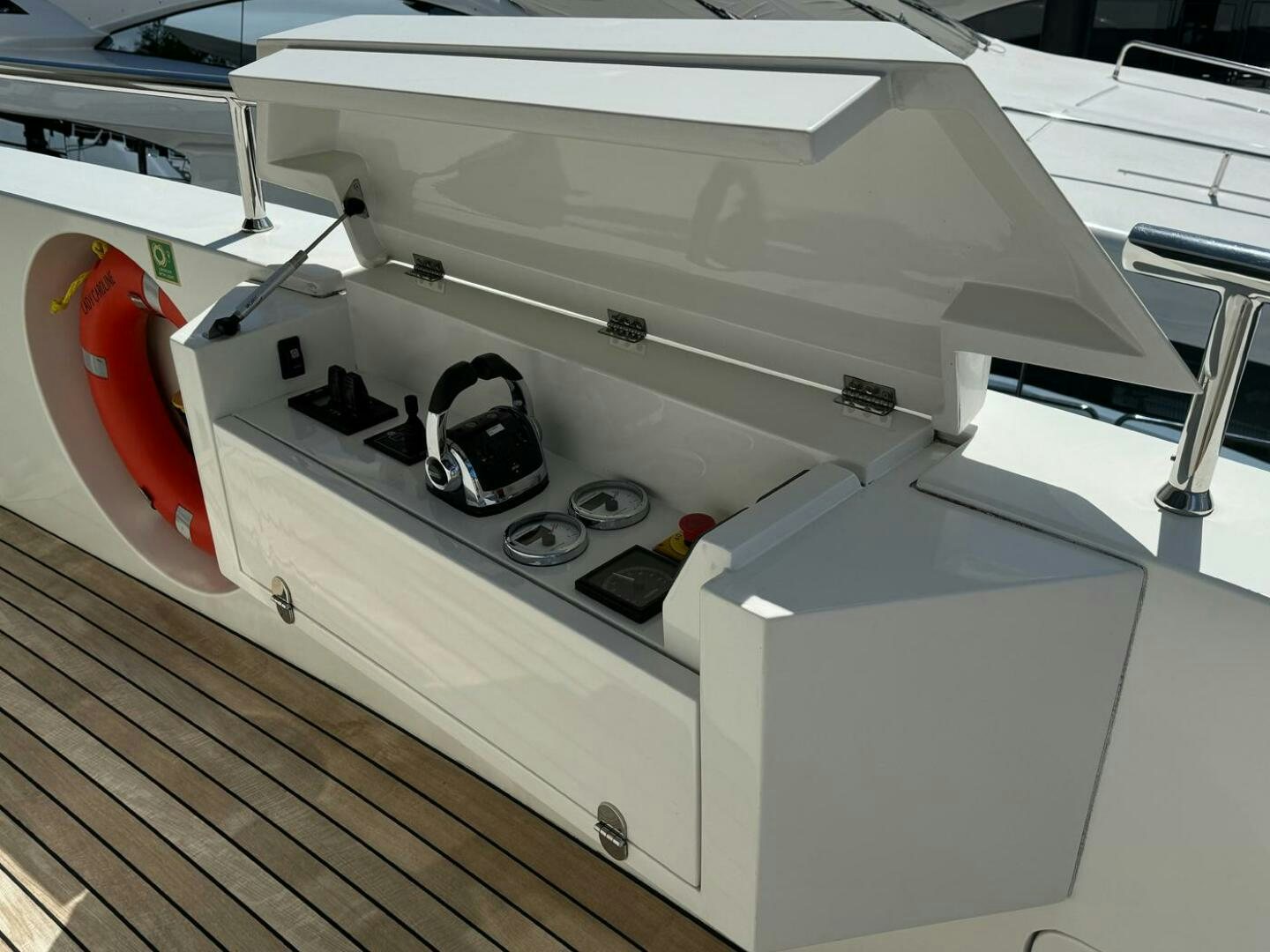 a white machine with a red and black object on the top aboard LADY CAROLINE Yacht for Sale