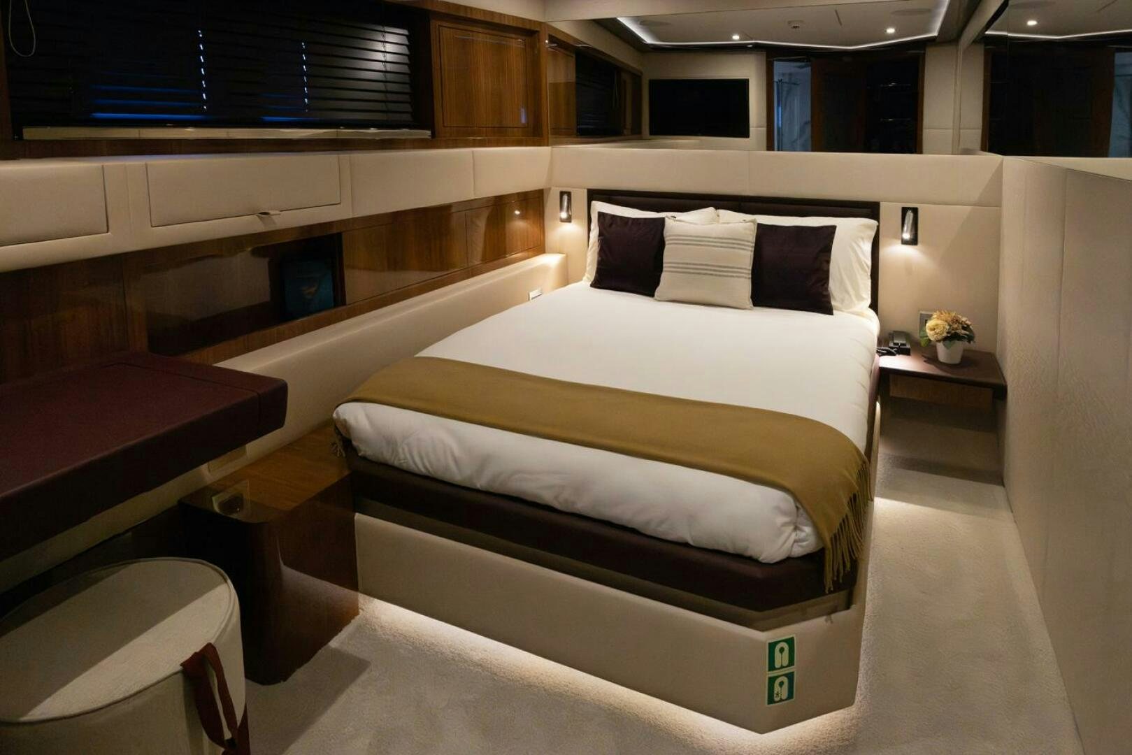 a room with a bed and a desk aboard LADY CAROLINE Yacht for Sale
