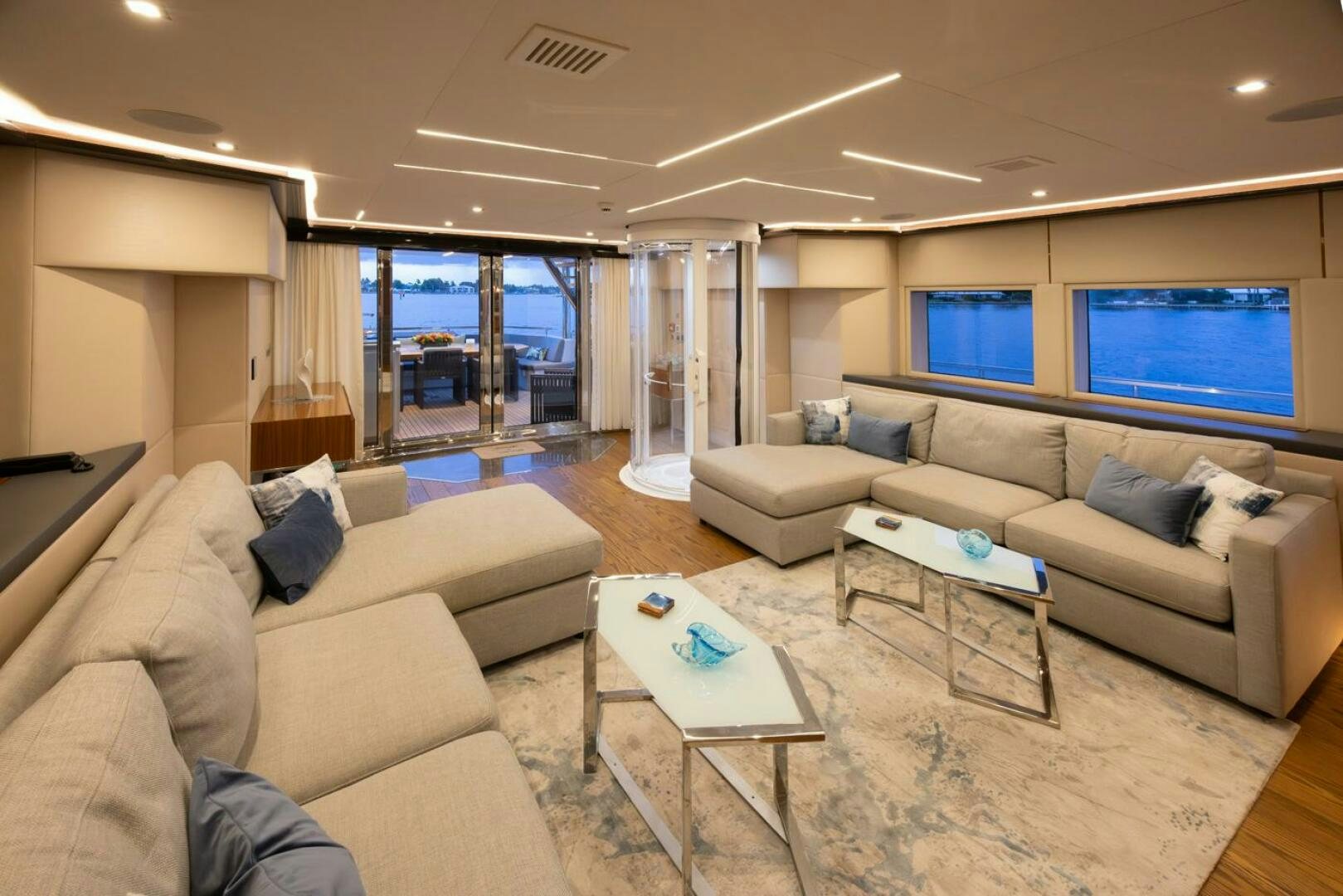 a living room with a large window aboard LADY CAROLINE Yacht for Sale