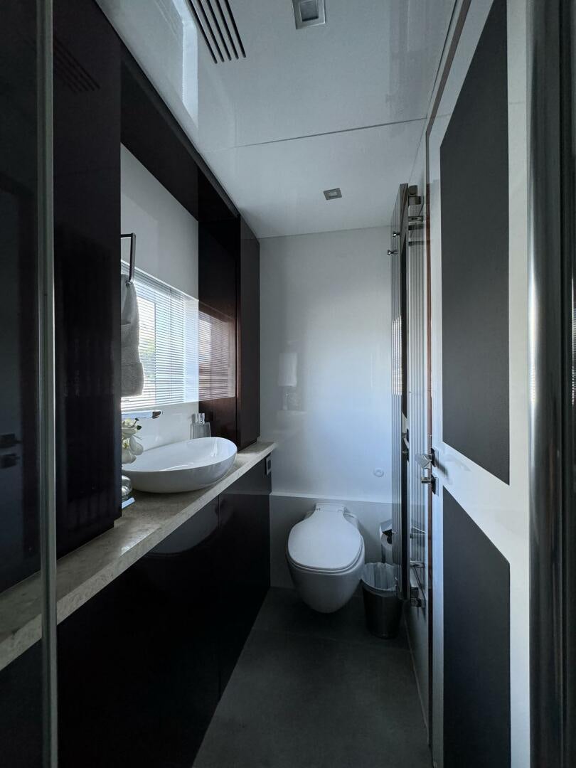 a bathroom with a sink and a toilet aboard LADY CAROLINE Yacht for Sale