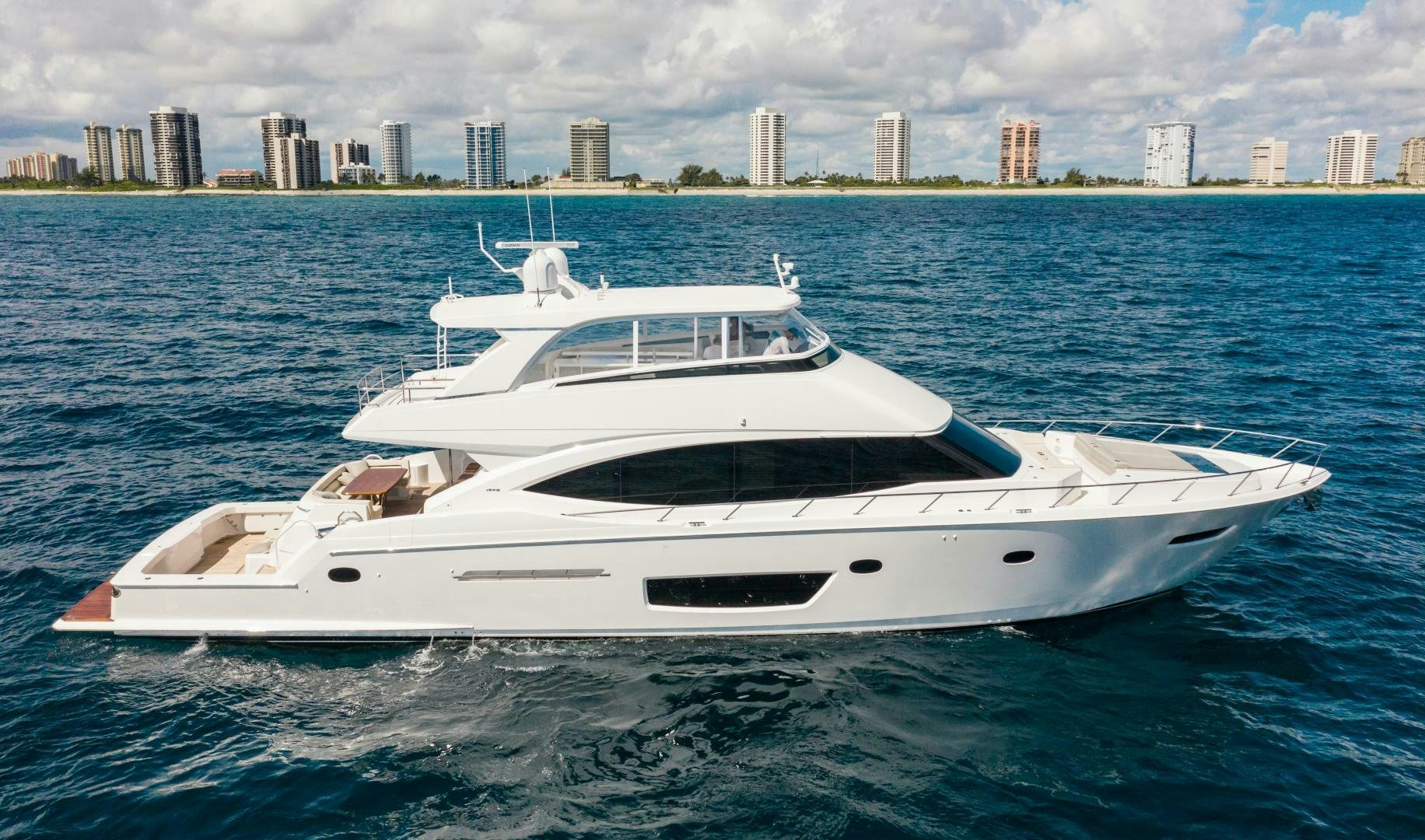 a white yacht in the water aboard MANA Yacht for Sale