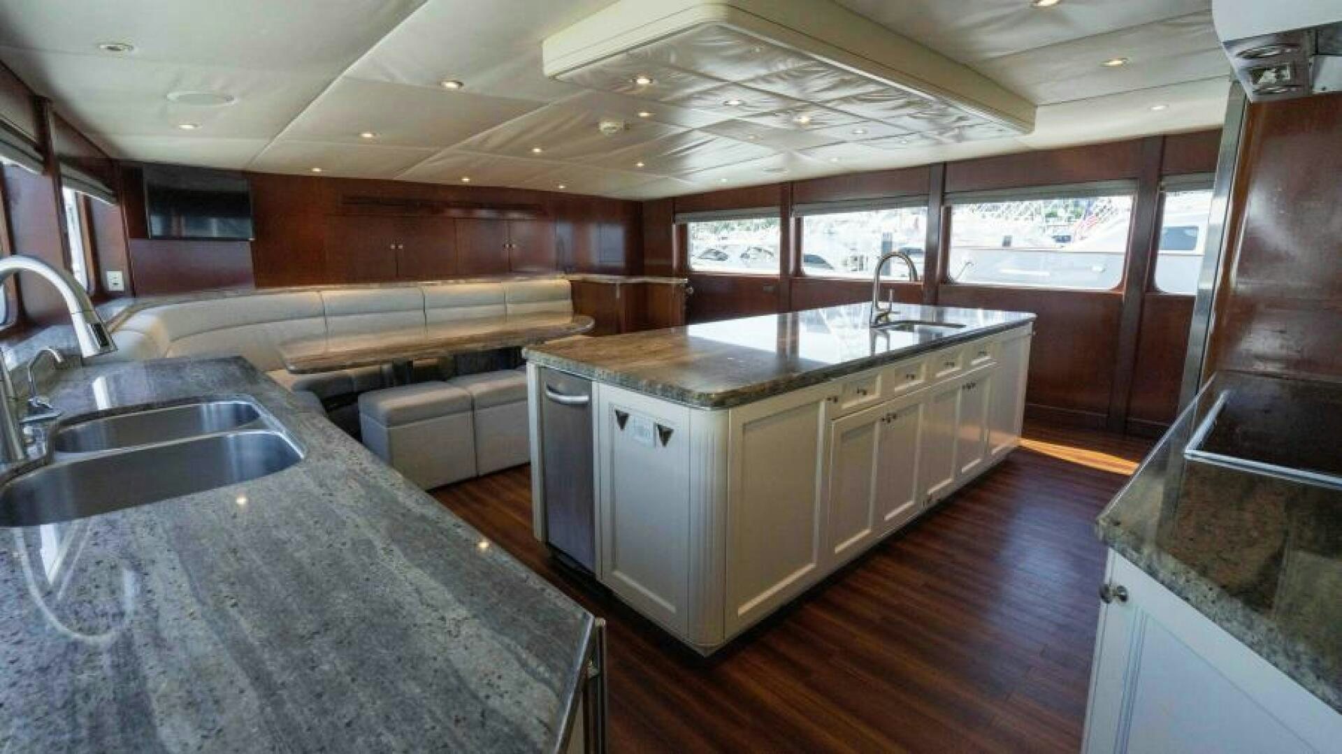 a kitchen with a large island aboard ODIN Yacht for Sale