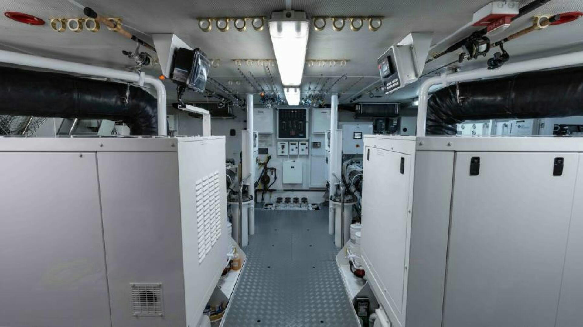 a room with many white cabinets aboard ODIN Yacht for Sale