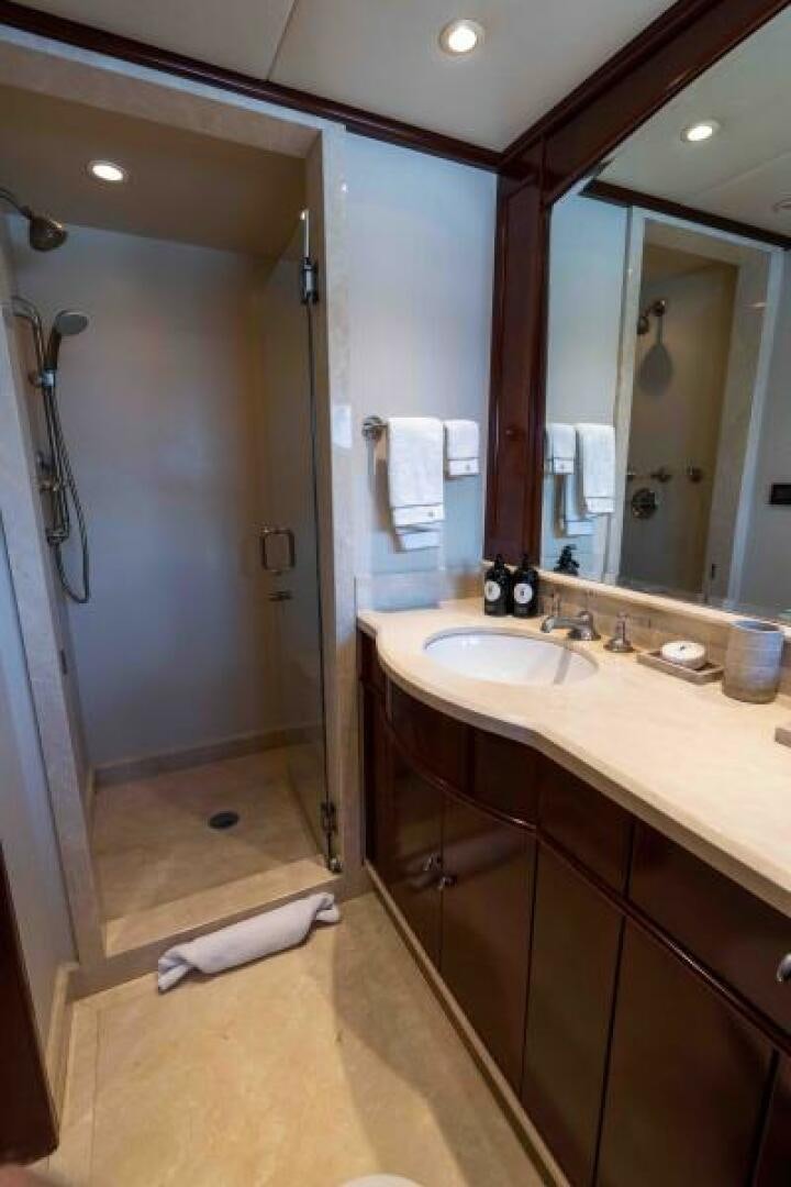 a bathroom with a sink and a mirror aboard ODIN Yacht for Sale