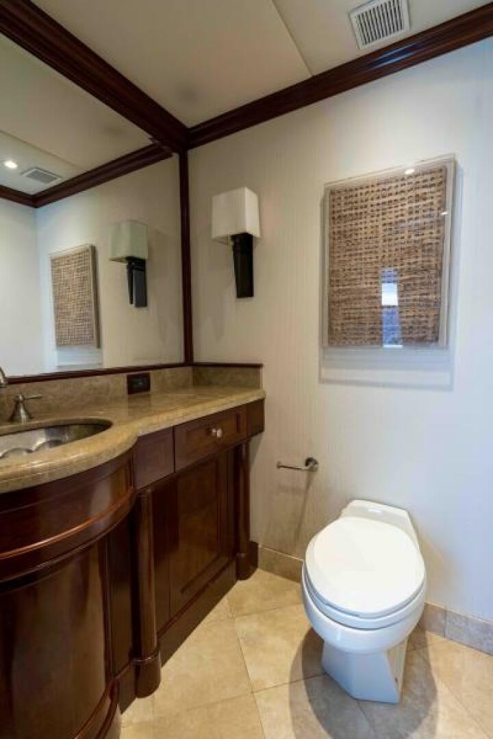 a bathroom with a toilet and a sink aboard ODIN Yacht for Sale